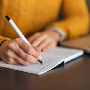 Woman writing in journal