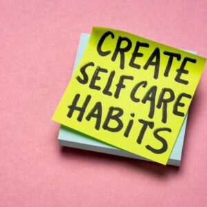 post-it note with the words create self care habits
