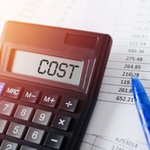 Calculator with Cost written on it