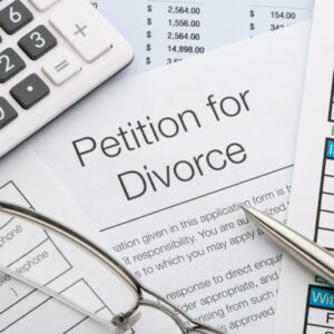 Petition for Divorce along with calculator, glasses and pen